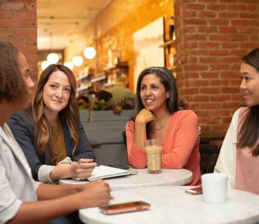 갱년기 증상 완화와 호르몬 건강, 일상 속 실천이 열쇠입니다 woman in black jacket sitting beside woman in white blazer