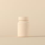 ‘맞춤형’으로 진화하는 영양, 내게 꼭 맞는 보충제 고르기 a bottle of medicine sitting on top of a table