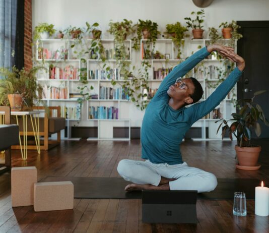 ‘마음 건강’ 지키기, 일상 속 작은 변화가 큰 힘 된다 a man is doing yoga in a living room
