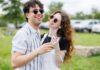 만성피로, 일상 속 작은 변화로 극복한다 Young couple laughing outdoors on a sunny day.