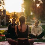 여성 건강관리, 일상 속 작은 변화에서 시작된다 a group of people sitting on top of a lush green field