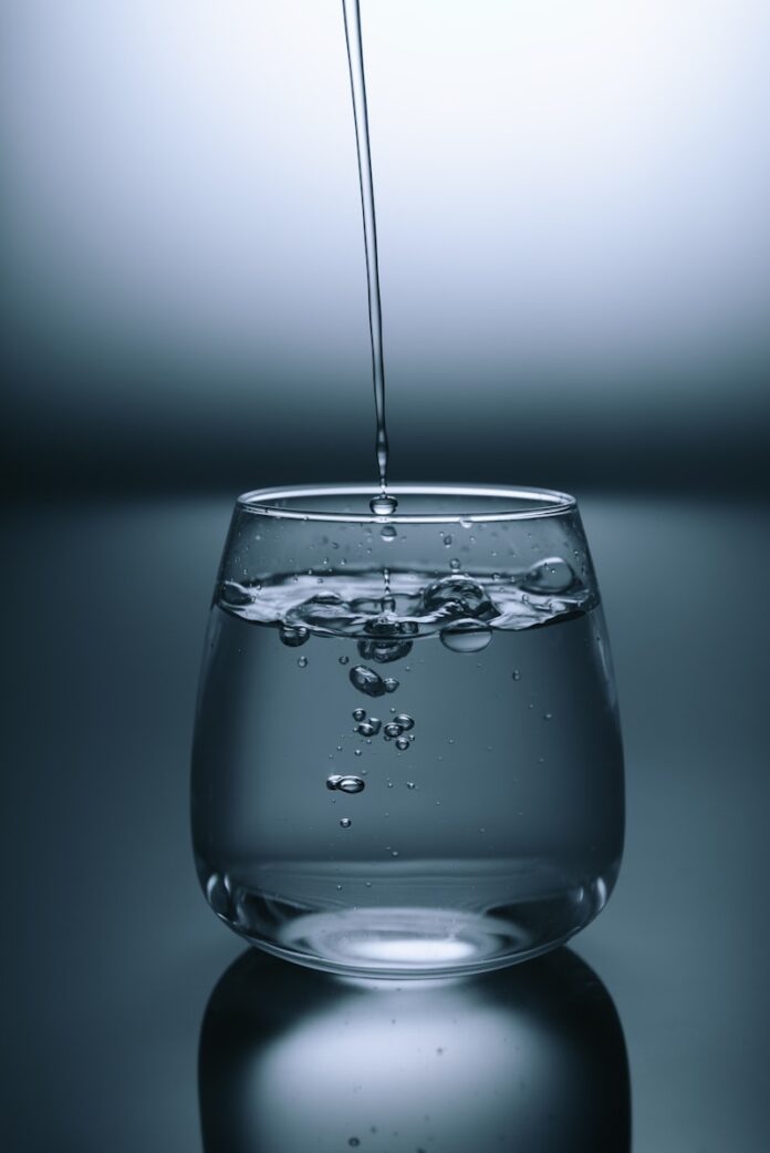 Photo by KOBU Agency clear drinking glass on gray surface