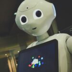 “내 건강 코치, AI로 진화하다”…일상 속 똑똑한 건강 관리법 white robot toy holding black tablet